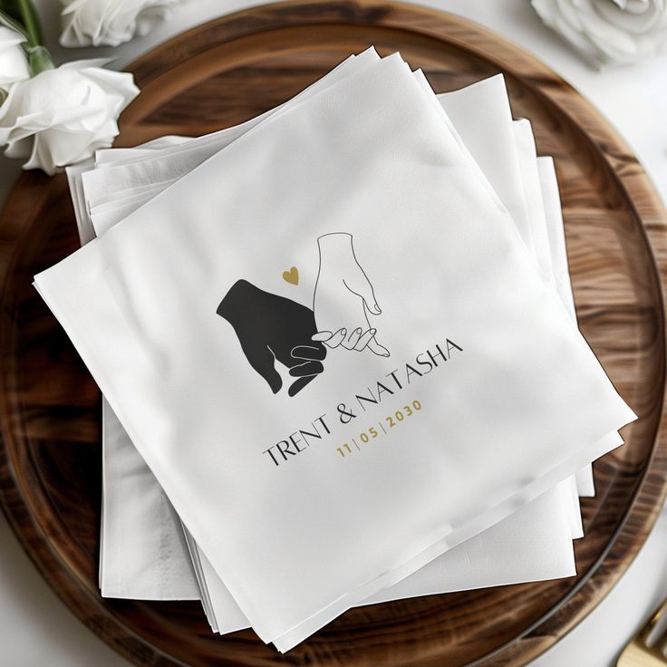 wedding napkins with the bride and groom's feet on them sitting on a plate