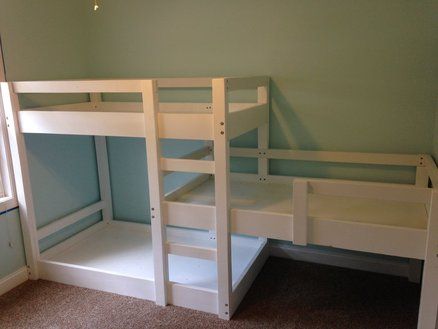 a bunk bed with two sets of stairs on the bottom and one set above it