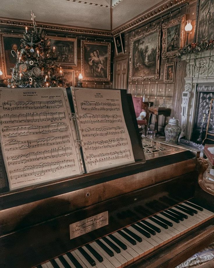 an old piano with sheet music on it