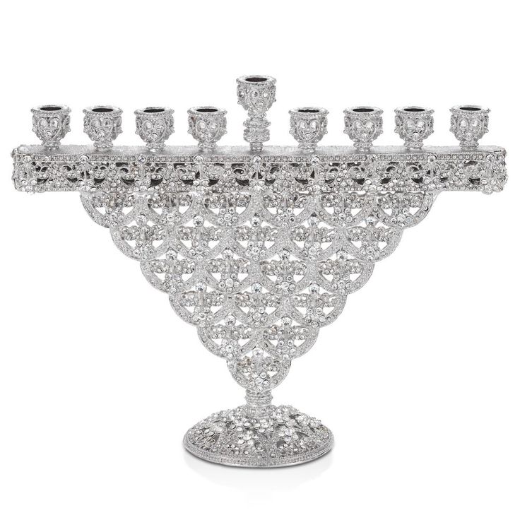 a crystal chandelier with six candles on it's base and several smaller ones in the center