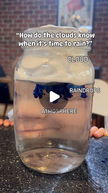 a glass jar filled with water sitting on top of a counter