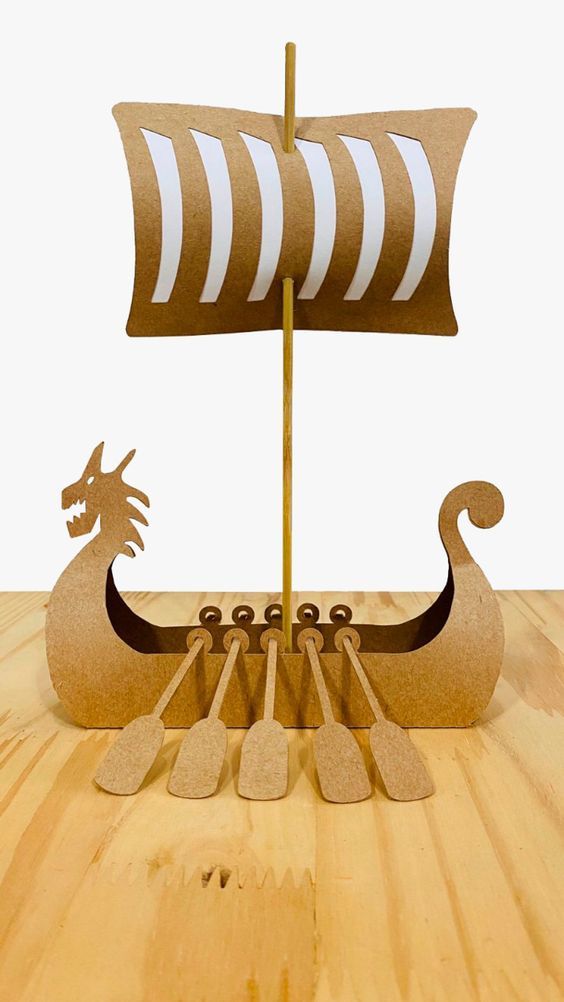 a wooden model of a boat with two dragon heads