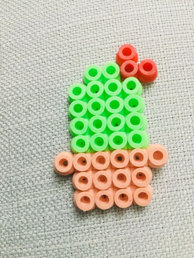 there is a small cactus made out of legos