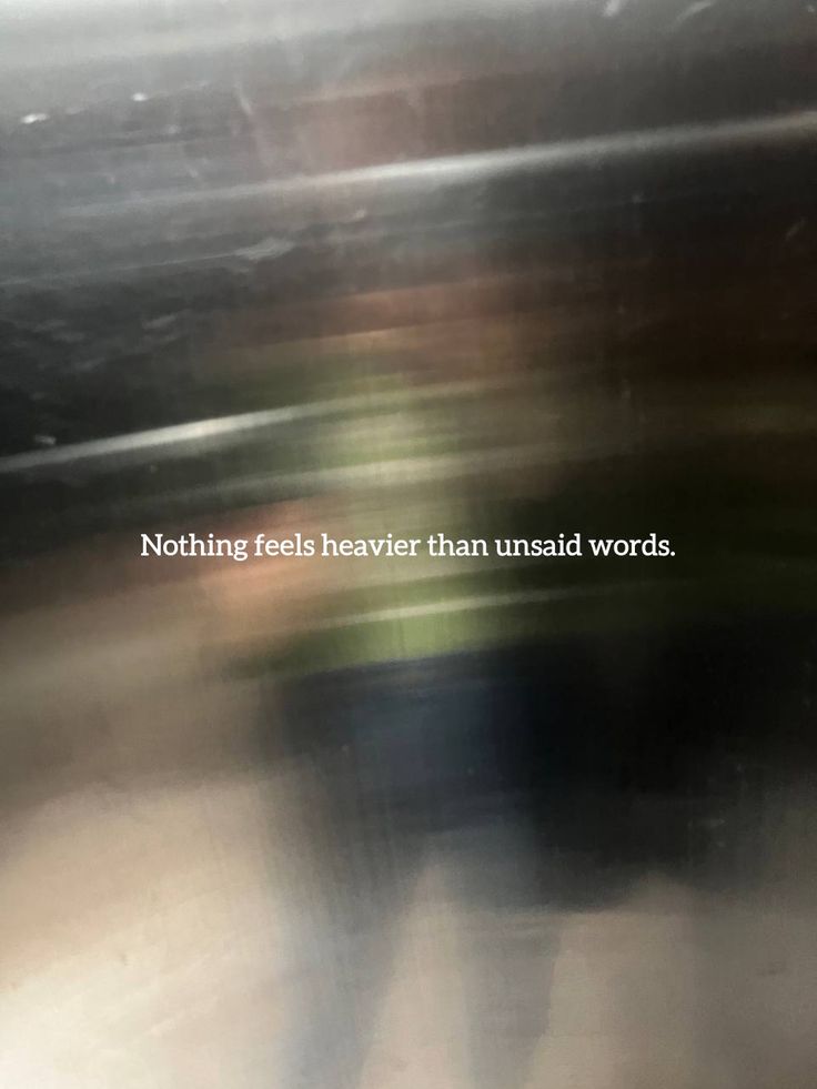 a blurry photo with the words nothing feels heavenly than unsaid words