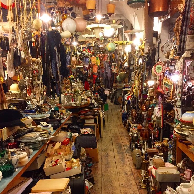 a room filled with lots of different types of items and lights hanging from the ceiling