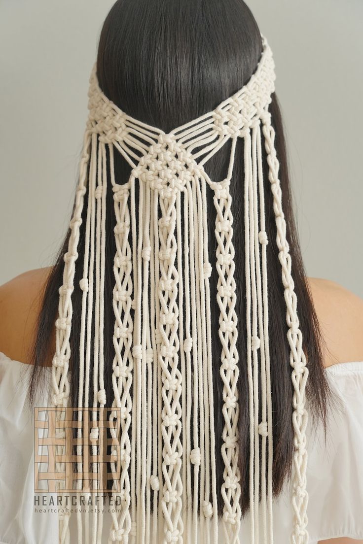 the back of a woman's head with white macrame