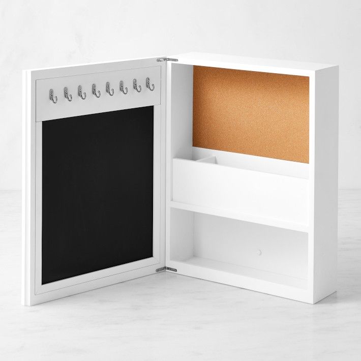 Whether you're coming or going, our exclusive organizer keeps all your essentials in one place. The wooden cabinet has a mirror outside and a plethora of storage inside. It's equipped with compartments for phones and mail, cork and magnetic boards for cards and messages, and hooks for keys and badges. Multifunctional organizer features mirror, corkboard, magnetic board, 3 compartments and 8 hooks. Made of durable engineered wood with white-painted finish and metal hardware. Comes with hanging ha Kitchen Wall Family Organizer, Mail Storage Ideas, Key Box Holder, Entry Organizer, Summer Cocktail Menu, Mirror Outside, Entry Organization, Mail Storage, Magnetic Boards