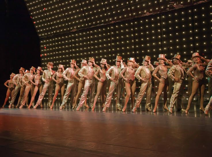 a group of people standing on top of a stage