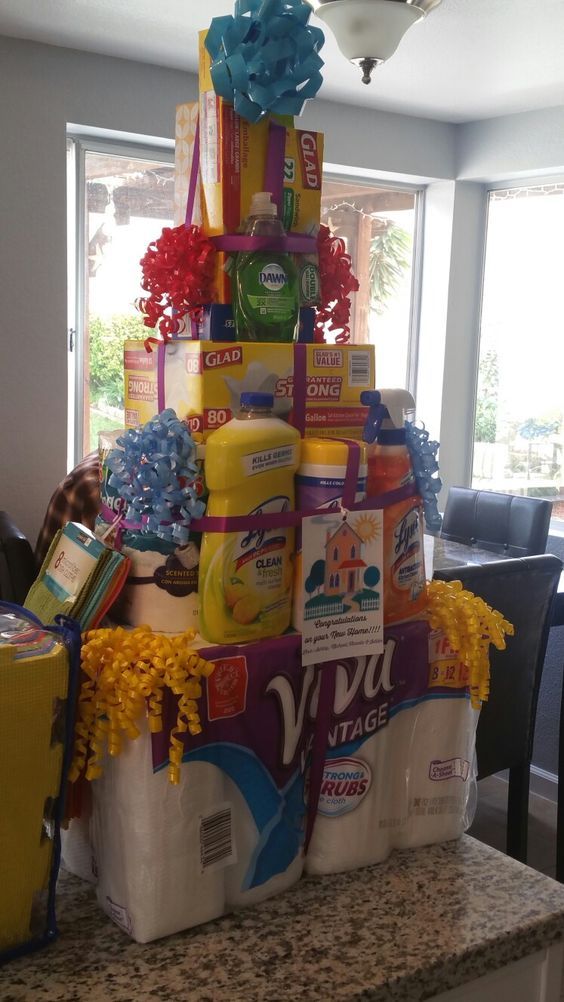 a large stack of cleaning products sitting on top of a counter