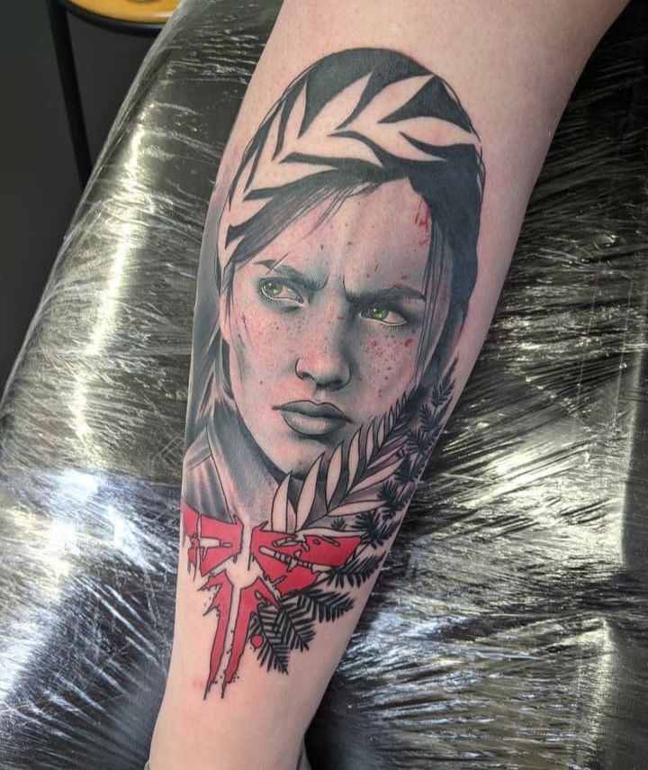 a woman's arm with a tattoo on it and an arrow in the center