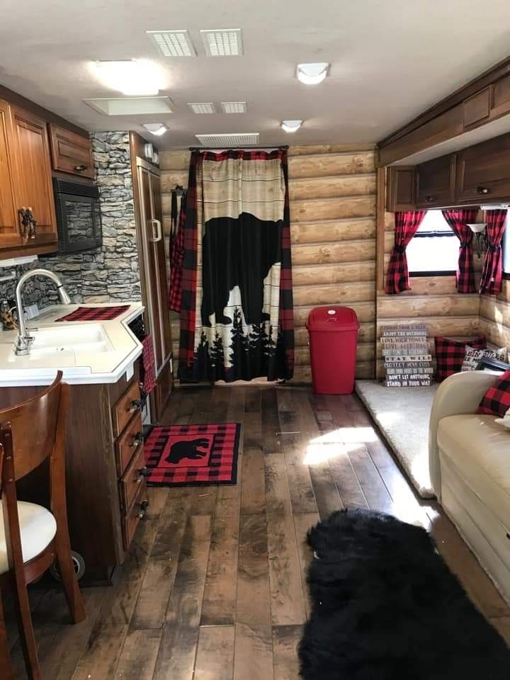 a living room with wood floors and walls