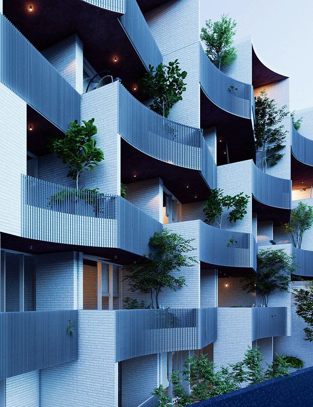 the building has many balconies and trees growing on it's sides as well