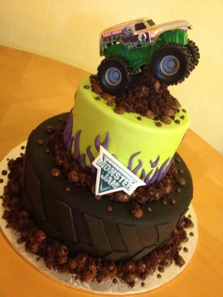 a monster truck cake on top of a table