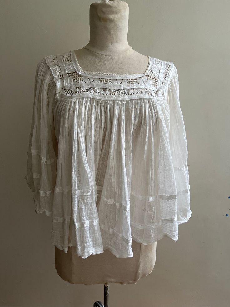 Great condition vintage womens below waist sheer Mexican top with lace and ribbon detail. Summer Cotton Lace Top With Lace Sleeves, Vintage Tops For Spring Gatherings, Vintage Style Tops For Spring Gatherings, Chic Cotton Lace Summer Tops, Chic Cotton Lace Tops For Summer, Fitted Cotton Lace Top With Ruffles, Cropped Tops With Lace Collar For Summer, Summer Cropped Tops With Lace Collar, Vintage Lace Top For Summer Daywear