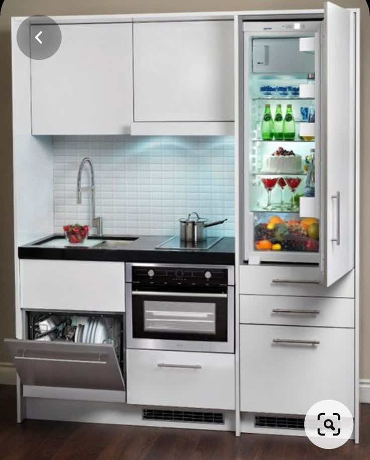 an open refrigerator in the middle of a kitchen