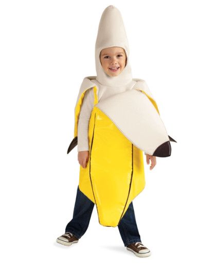 a little boy dressed in a banana costume