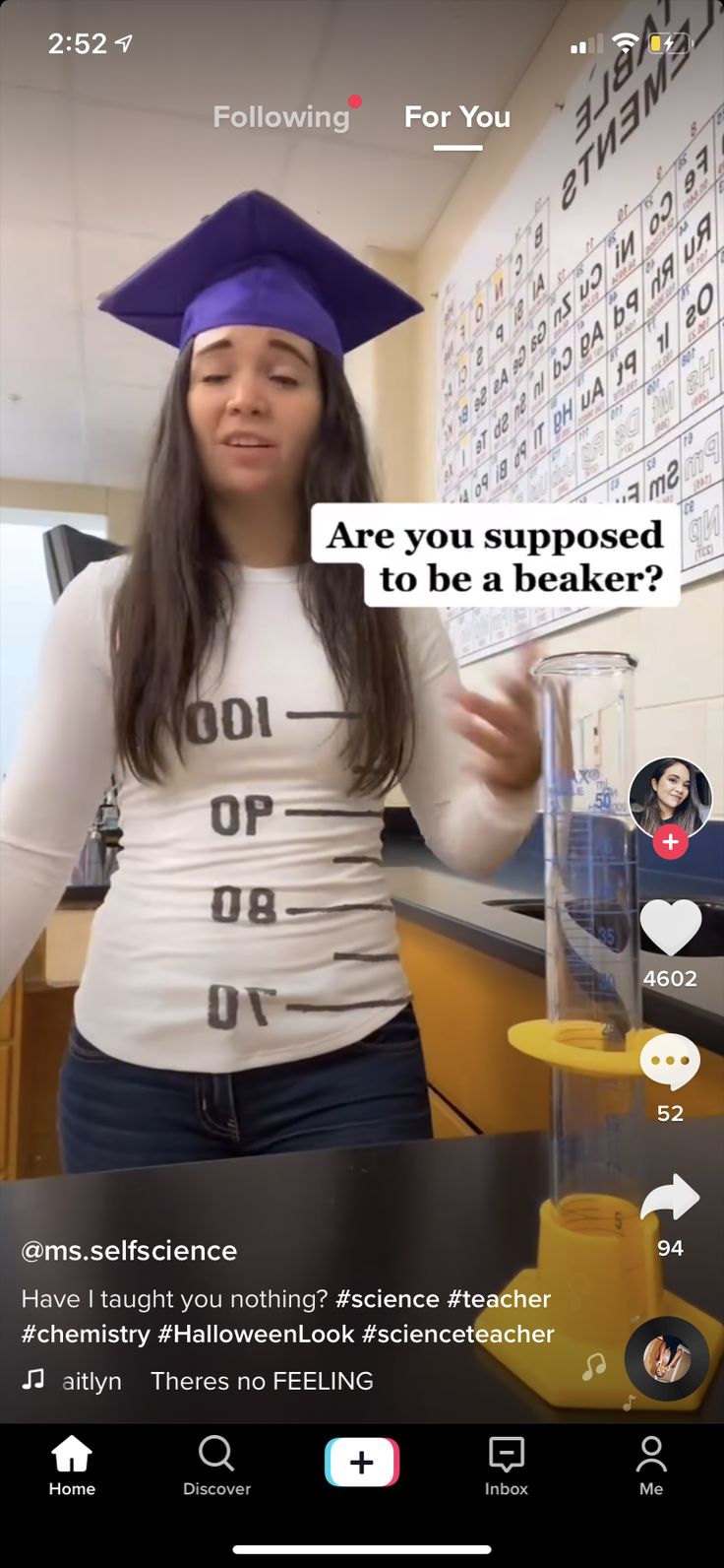 a woman wearing a graduation cap and holding a beakle in front of her face with the caption'are you supposed to be a teacher? '