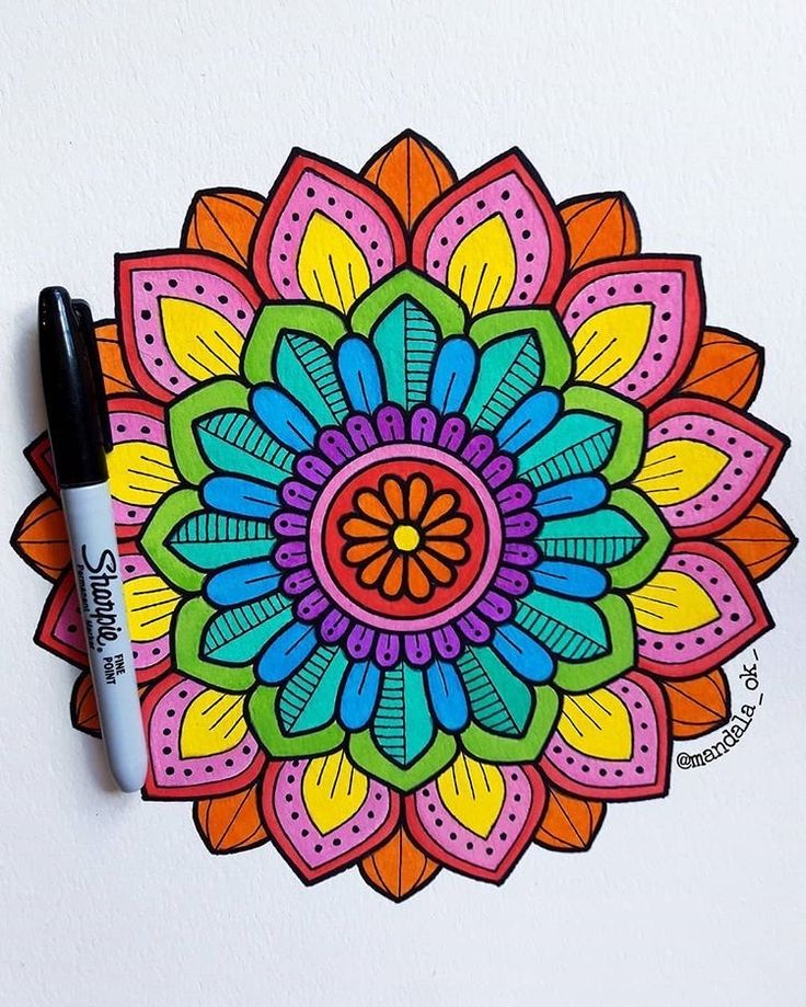 a drawing of a colorful flower with markers