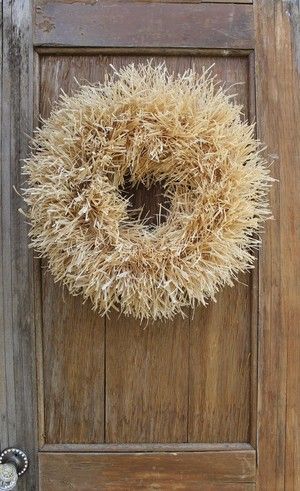 a door with a wreath hanging on it