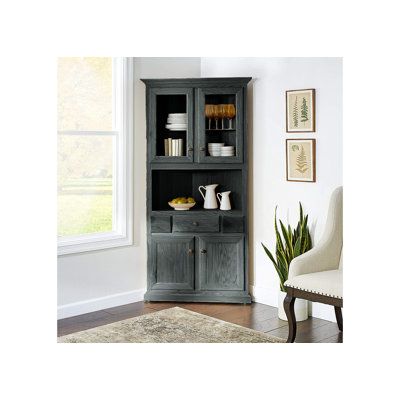 a gray bookcase with glass doors and shelves