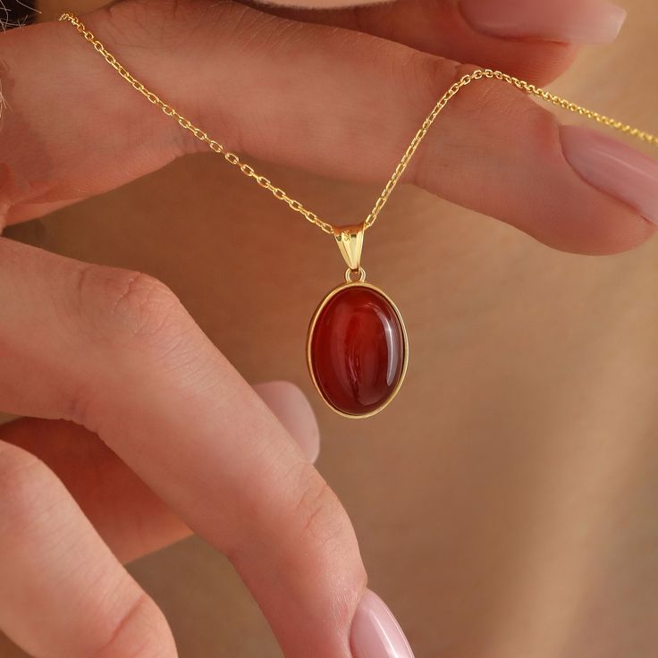 "Presenting our captivating Carnelian Stone Necklace, a harmonious fusion of aesthetic allure and spiritual significance. Meticulously crafted, this necklace serves as a showcase for the distinctive Carnelian stone, celebrated for its powerful ability to ignite motivation and creativity.  As you adorn this carefully designed necklace, you infuse your energy with the essence of vitality and inspiration. With its captivating aesthetics and transformative properties, this necklace becomes a wearabl Gold Pendant Aesthetic, Real Gold Necklaces, Gold Stacked Jewelry, Simple Gold Jewelry Aesthetic, Red Jewelry Aesthetic, Dainty Jewelry Aesthetic, Crystal Necklace Aesthetic, Gold Necklace Aesthetic, Red Jewelry Necklace