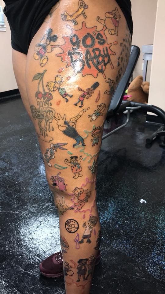 a person with tattoos on their legs