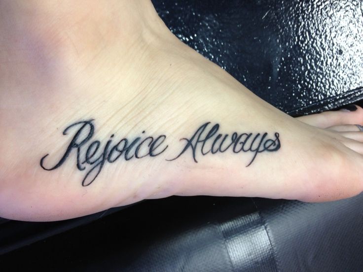 a person with a tattoo on their foot that reads, rejoce alwayss