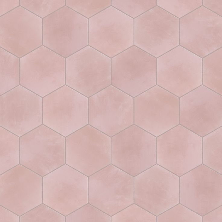 a pink tile pattern with hexagonal shapes