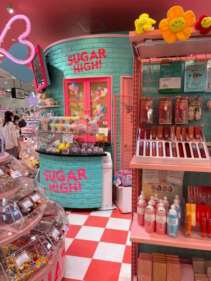 the inside of a candy shop with pink walls and checkered flooring on the ground