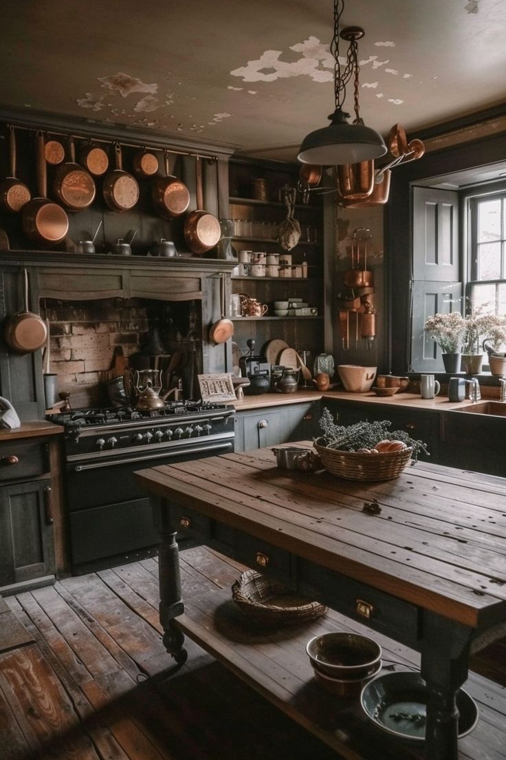 an old fashioned kitchen with lots of pots and pans