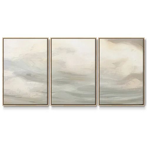 three abstract paintings on a white wall with grey and beige colors, one in the foreground