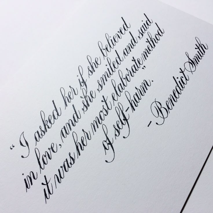 a handwritten poem on white paper with black ink