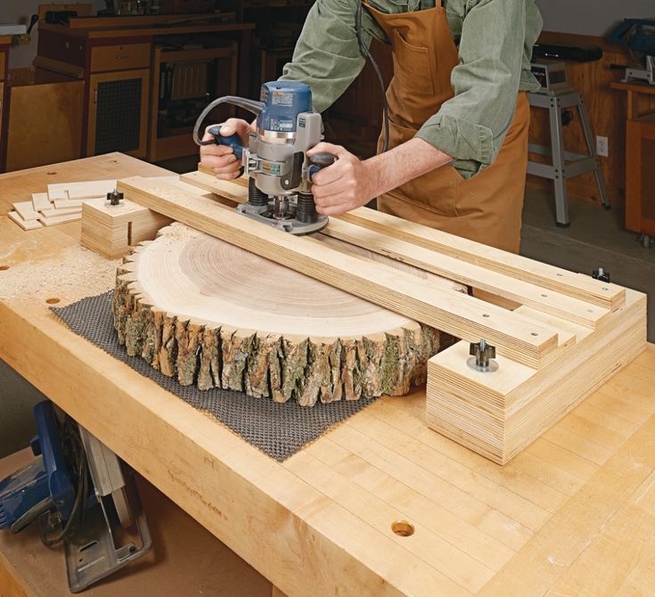 a man using a router to cut wood with a circular sawtoothing machine