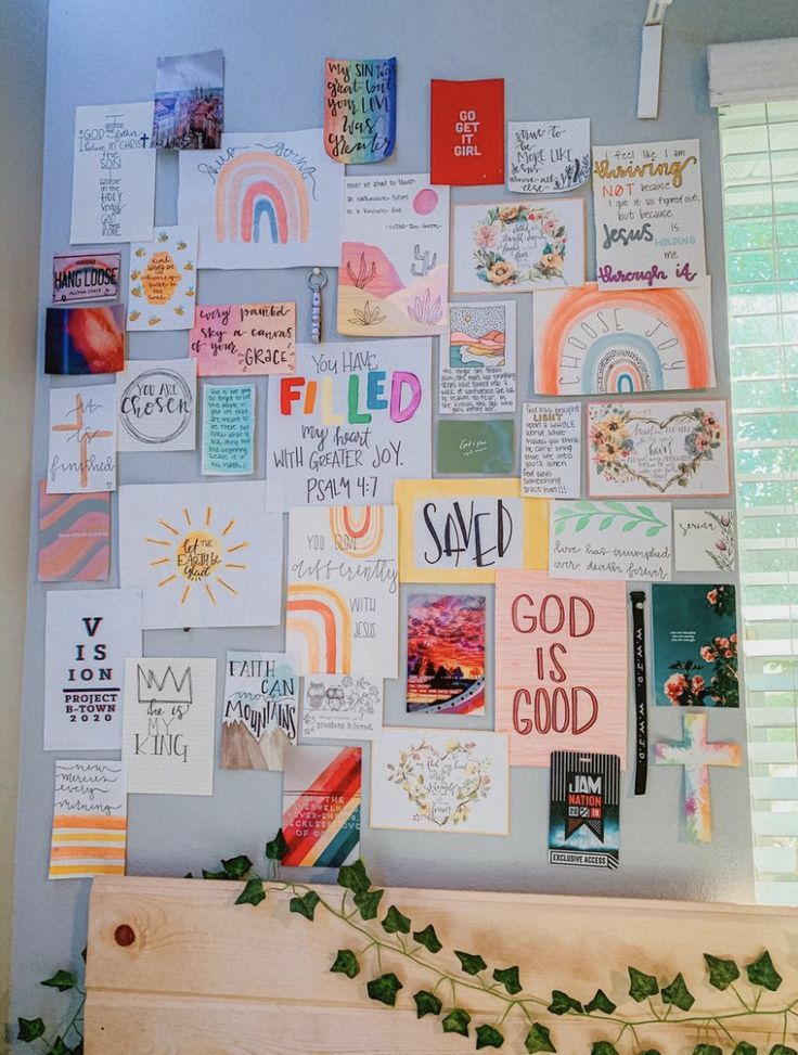 a bulletin board covered in lots of different types of cards and magnets on it