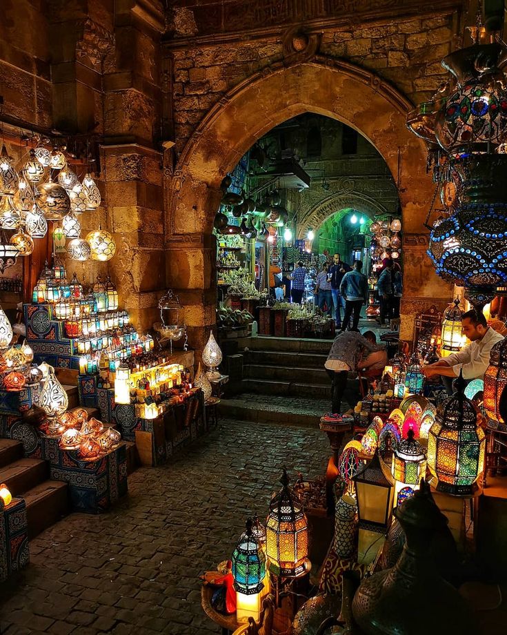 an open market with lots of lit up lanterns