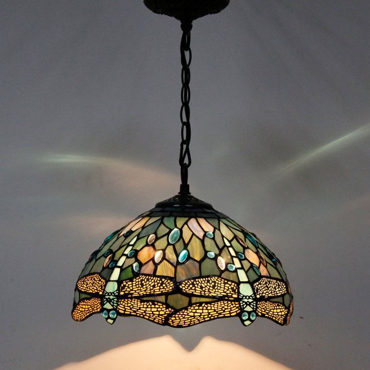 a stained glass lamp hanging from a ceiling