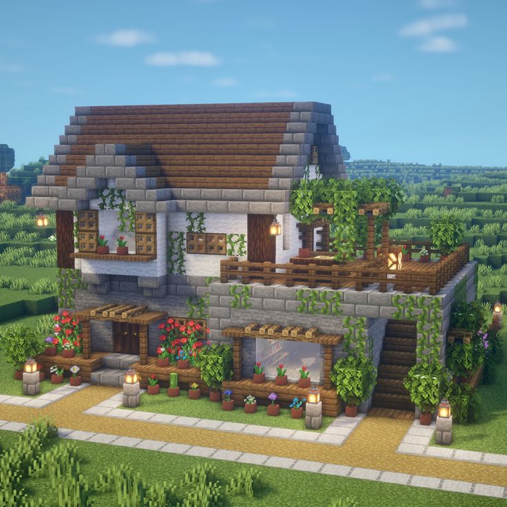 a very nice looking house with lots of plants on the front and side of it