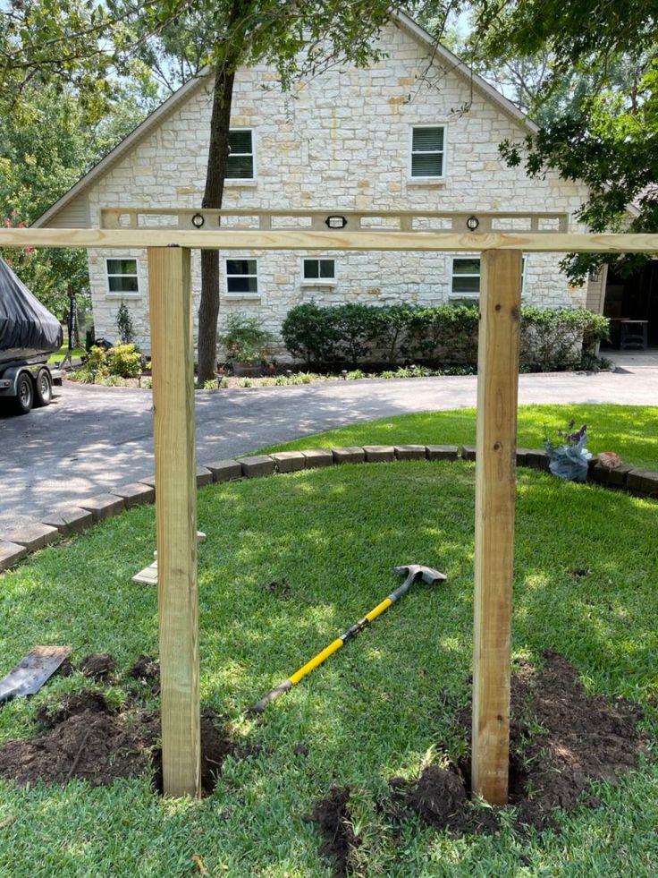 a wooden structure sitting in the middle of a yard