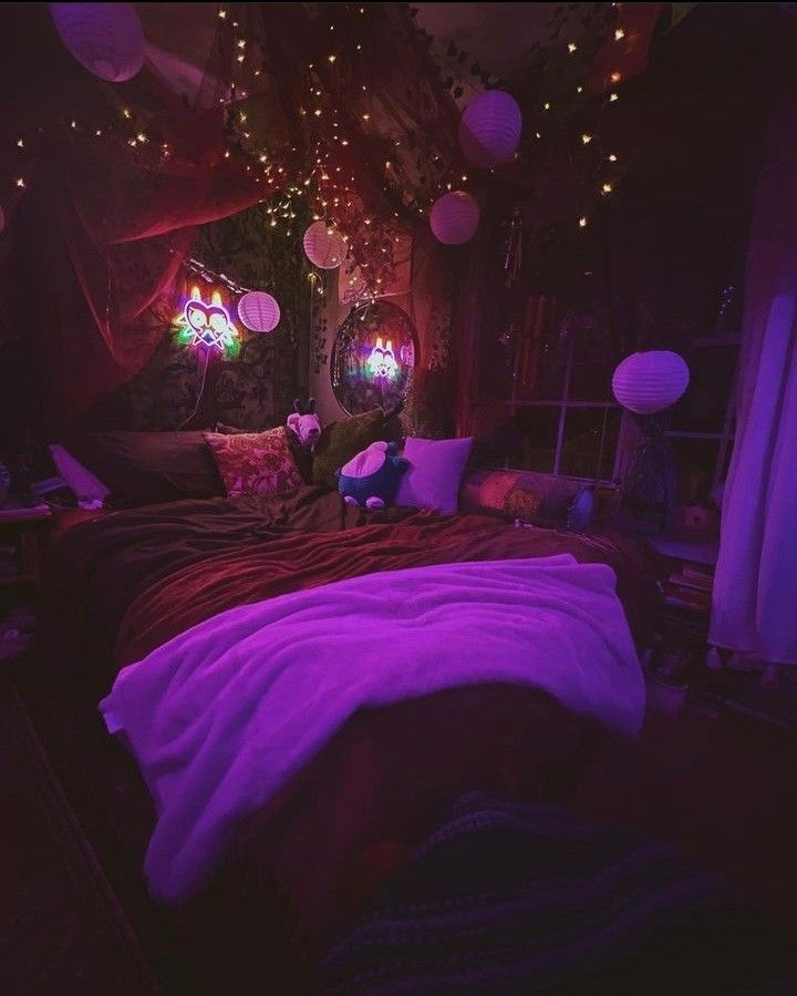 a bed room with a neatly made bed and lots of lights