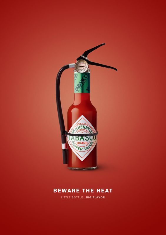 a bottle with a hose attached to it and the caption beware the heat