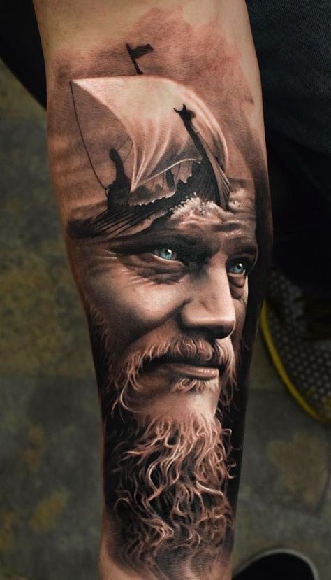 a man's arm with an old ship on it