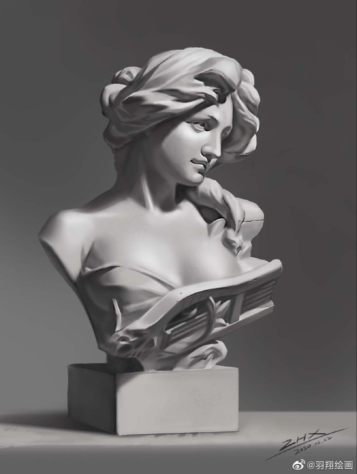 a sculpture of a woman holding a book