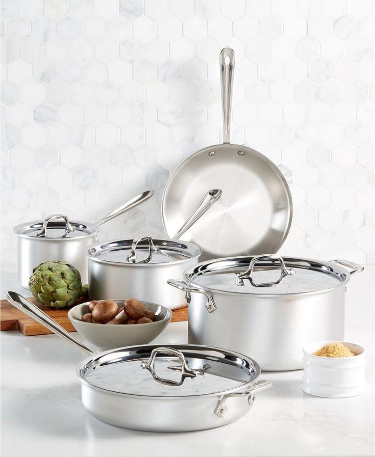 an assortment of pots and pans on a counter