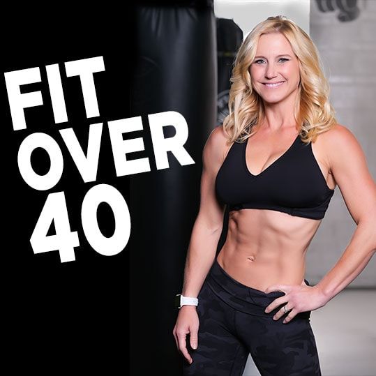 a woman standing next to a punching bag with the words fit over 40 on it