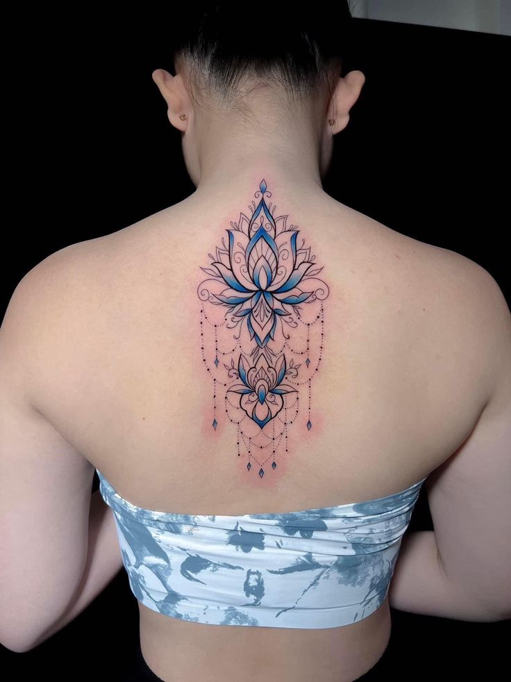 a woman with a tattoo on her back