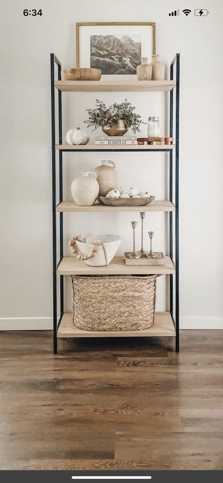 a shelf with baskets and other items on it