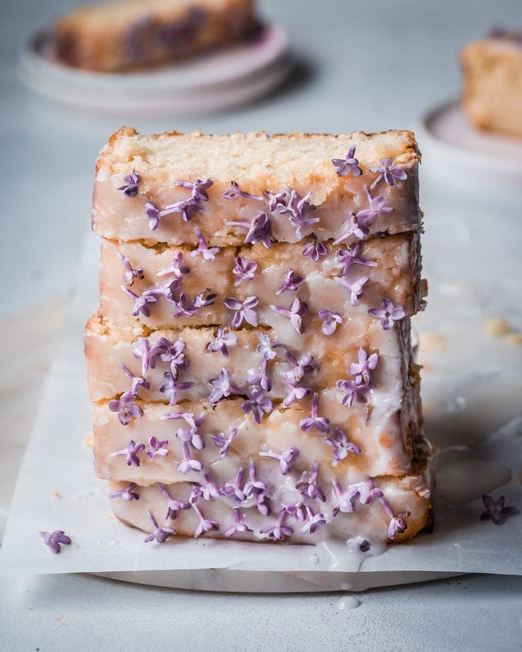 two pieces of cake with purple flowers on them