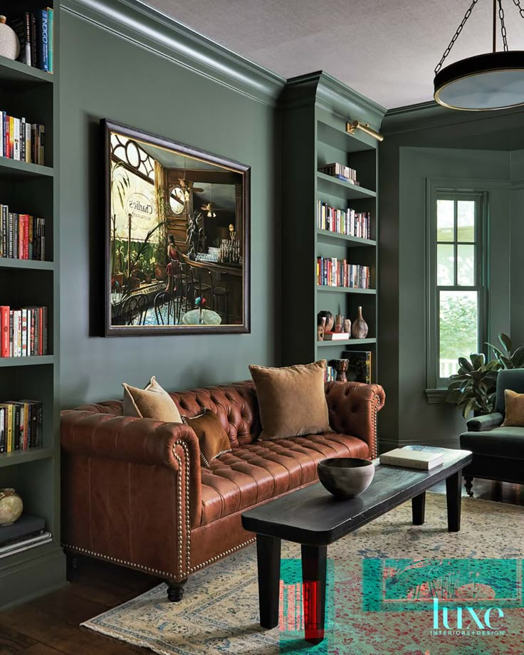 a living room filled with furniture and bookshelves