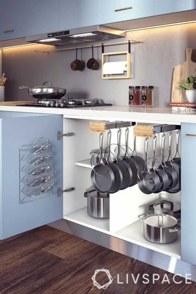 a kitchen with pots and pans hanging from the wall