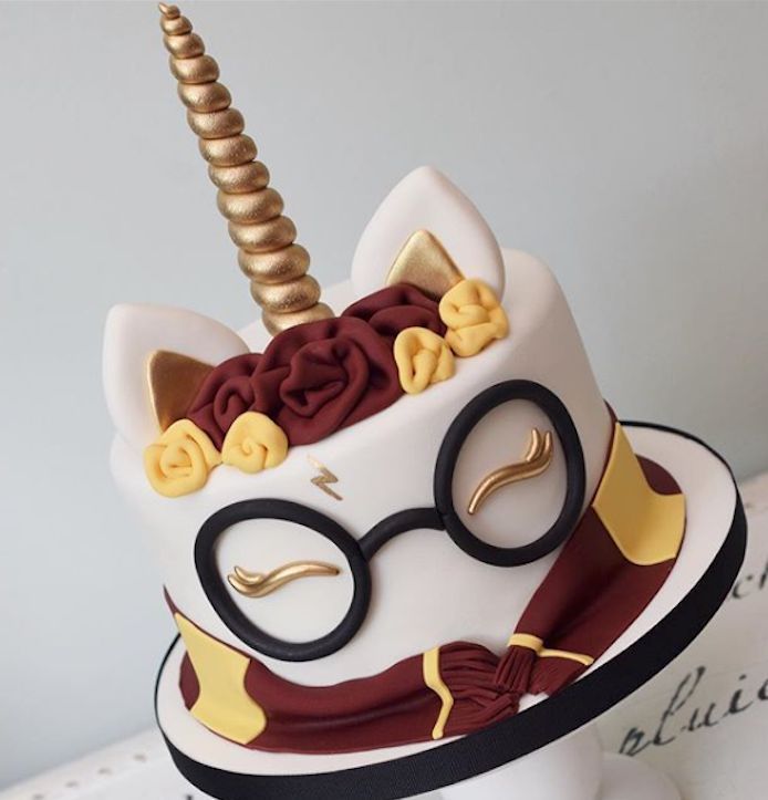 a cake decorated with a unicorn's horn and glasses